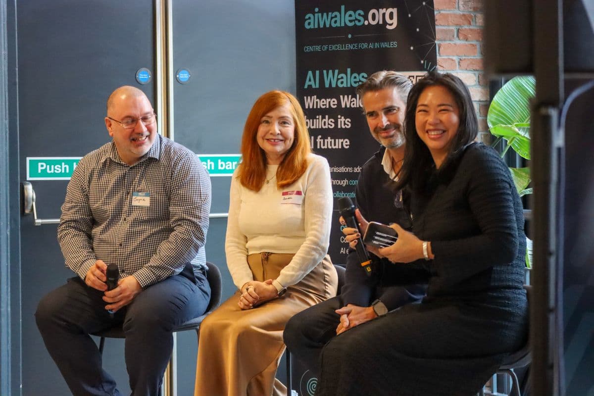 AI Wales community members in conversation at AI Hub Launch