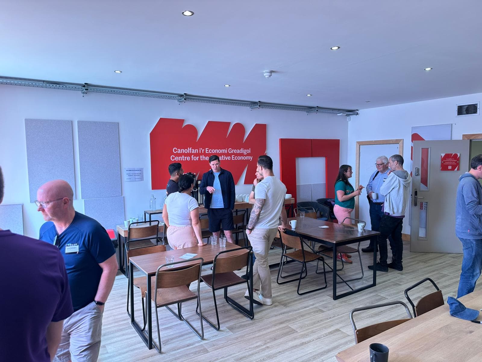 AI Wales networking event at Centre for the Creative Economy showing attendees mingling