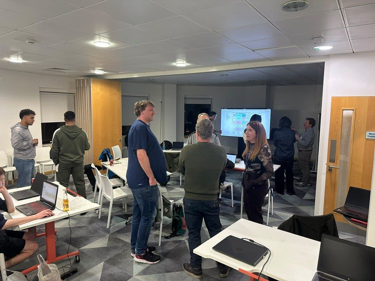 Attendees talking through their RAG builds after the workshop