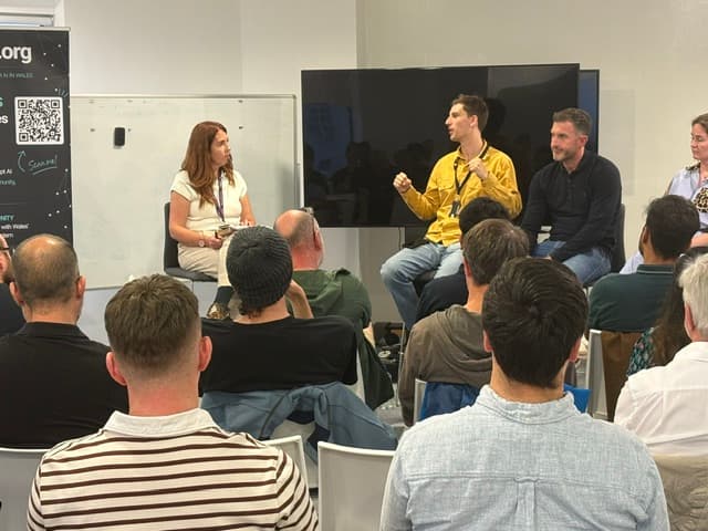 Panel discussion viewed from the side of the audience